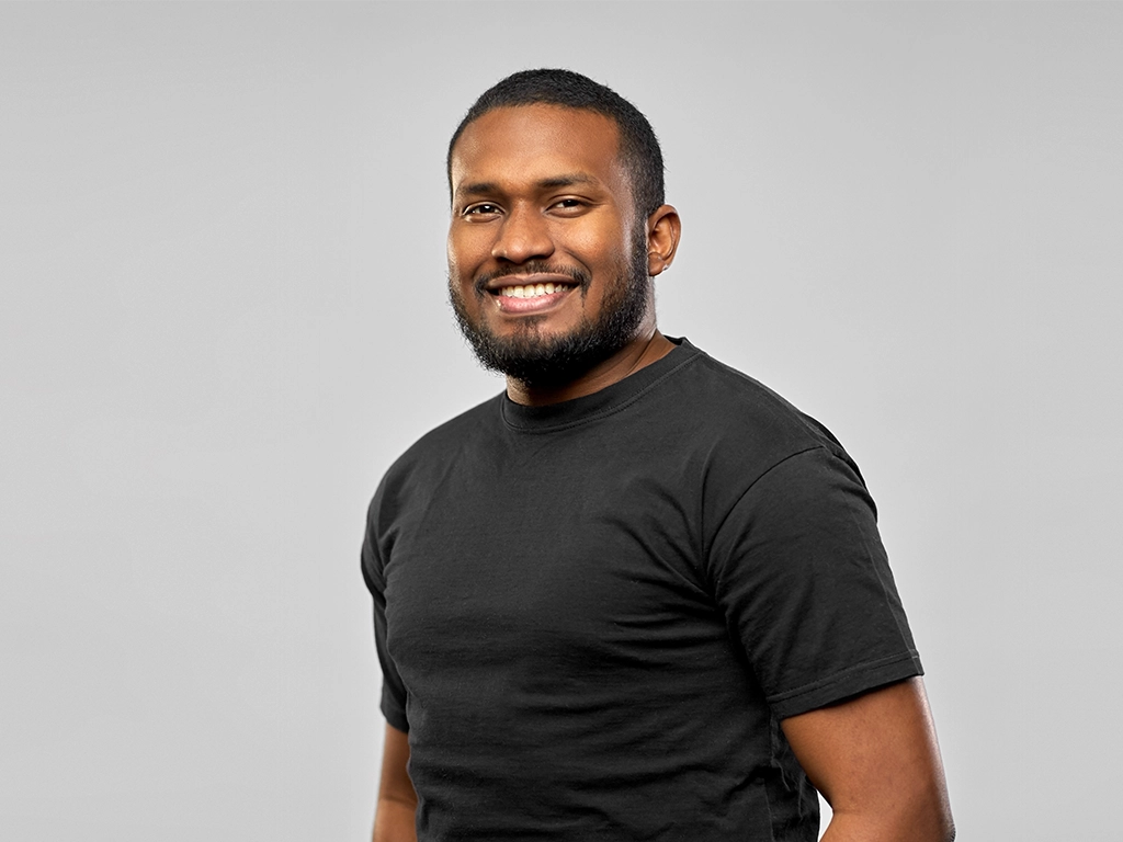 Smiling man showing healthy smile after root canal treatment
