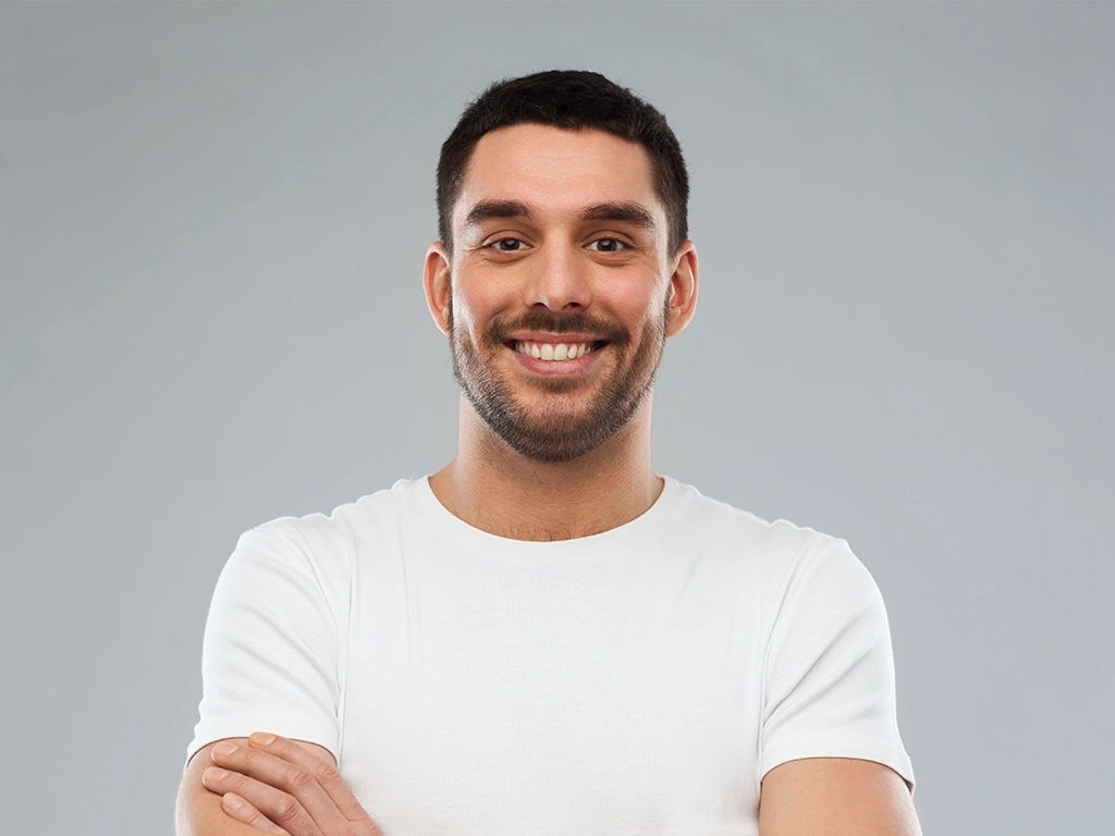 Smiling man with confident, protected smile from custom mouthguards