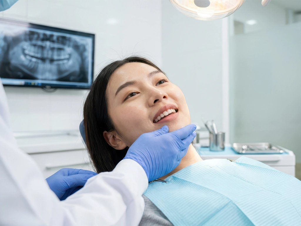 Relaxed patient smiling during sedation dentistry visit
